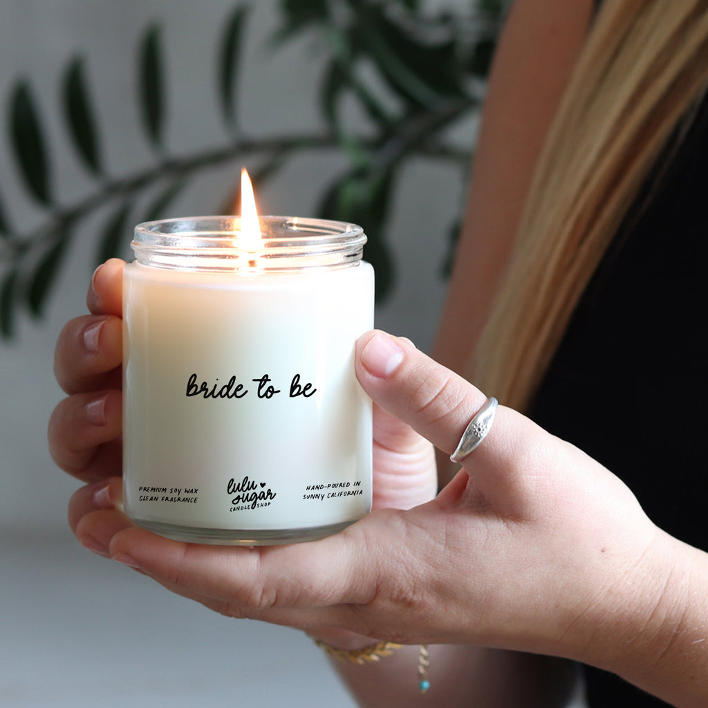 Bride to be candle gift held in hands, perfect engagement gift for bride or bridal shower.