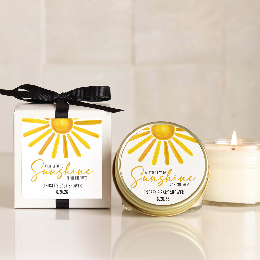 A little Ray of Sunshine baby shower favor candles with personalized labels and eco-friendly packaging.