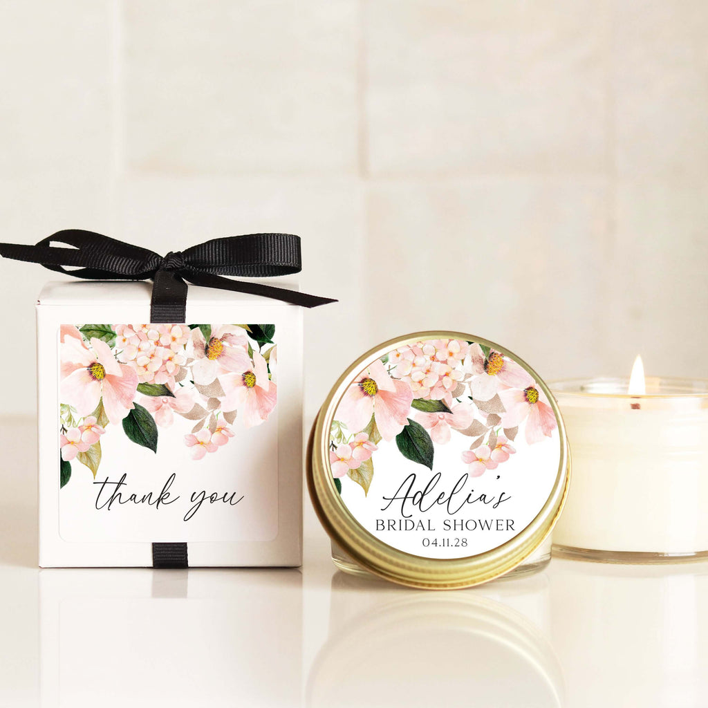 Personalized candle favors for bridal shower with blush floral labels, eco-friendly design, and elegant packaging.