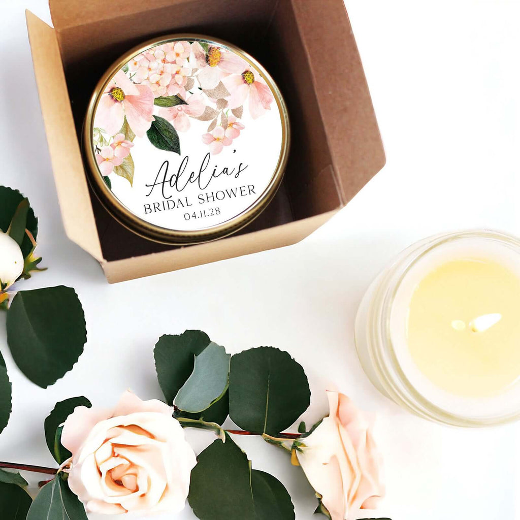 Personalized candle favors for bridal shower with blush floral label in eco-friendly packaging. Elegant gift for guests.