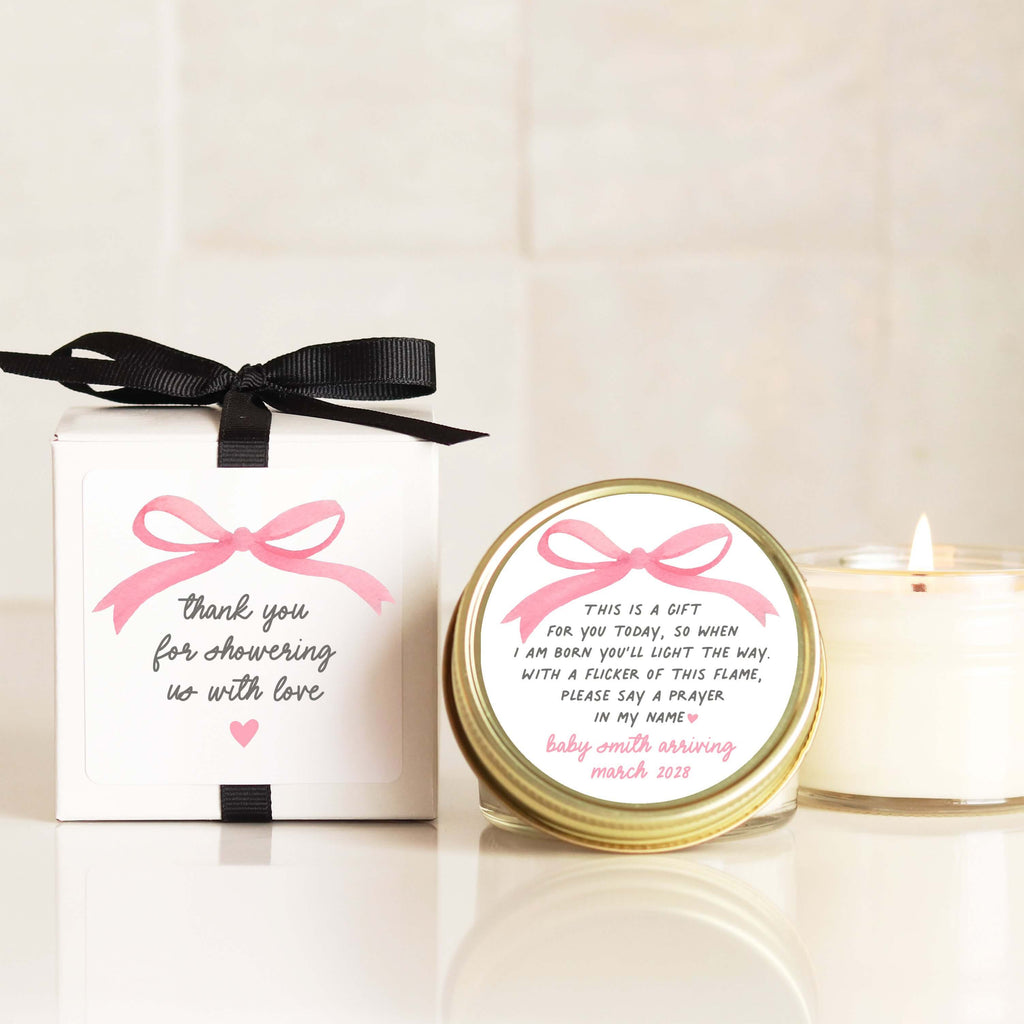 Personalized baby shower candles with pink bow labels and prayer poem. Perfect favors for guests.