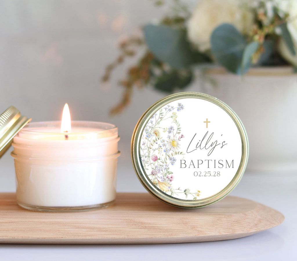 Baptism candle favor with wildflower label design, personalizing 'Lilly's Baptism' with eco-friendly candle on wooden tray.